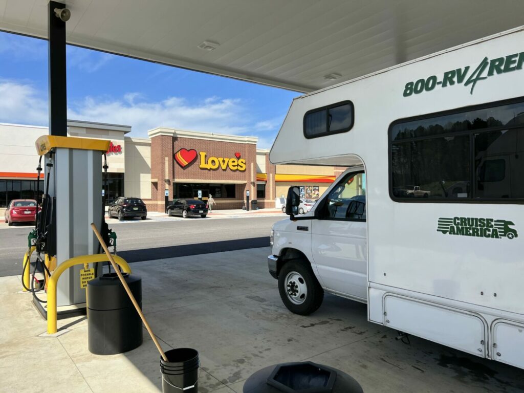 An RV getting gas at a Loves gas station