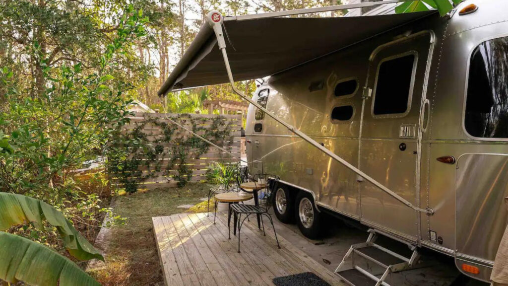 An airbnb rv rental in a backyard 