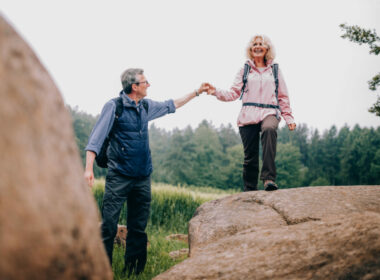 A senior couple in a park after using their national park pass for seniors to enter