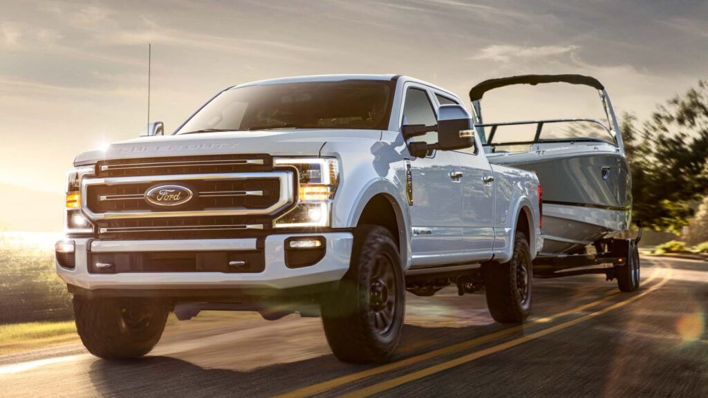 A white ford f250 on the road which is different vs a ford150