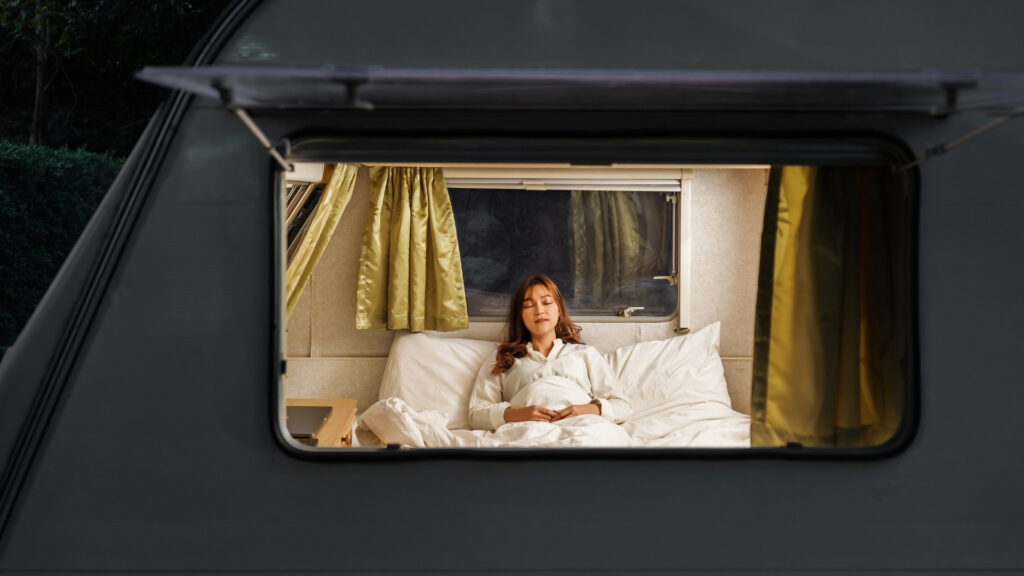 A woman sleeping on her wilderness RV mattress