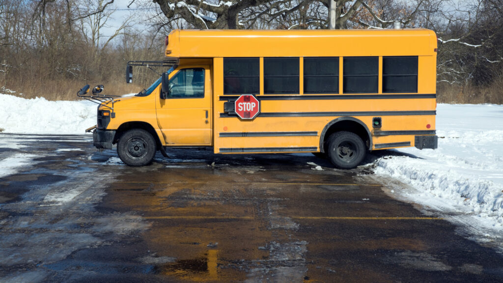 A type A school bus parked after figuring out how much does a school bus weighs
