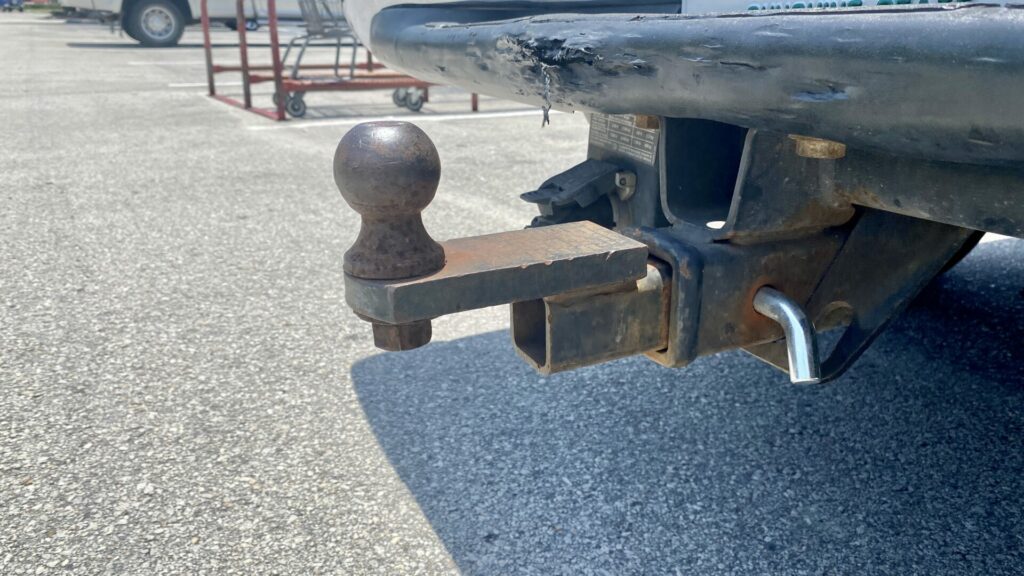 A rusty trailer hitch ball that could use some grease 