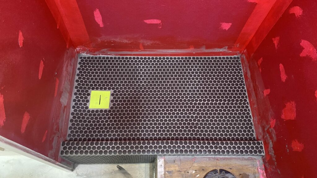 A new tiled shower floor in a trailer