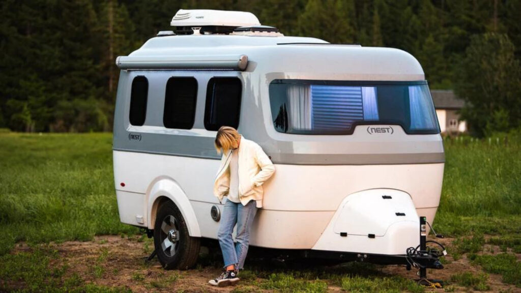 A woman standing outside of her Airstream Nest
