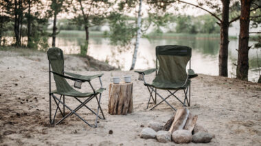 Image of rocking camp chairs by a lake