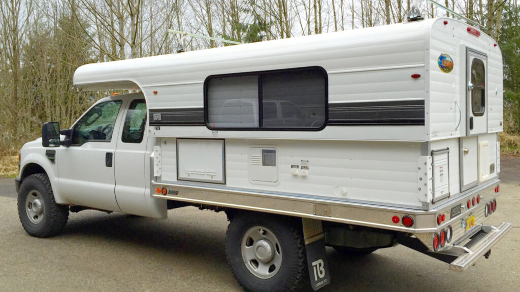 An Alaskan Camper attached to a truck