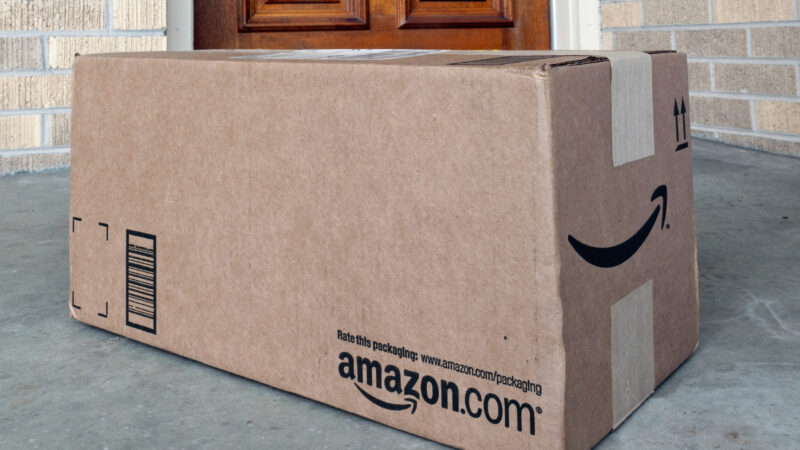 An Amazon box outside of someones home with RV parts inside