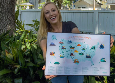 Rae Miller of Getaway Couple holding National Park Map