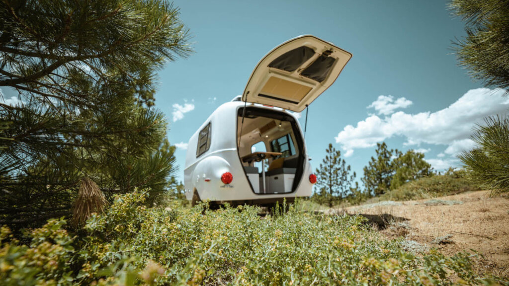 A Happier mini camper parked outside