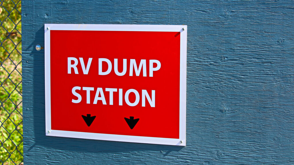 A sign for an RV dump station, which are uncommon to see at rv friendly gas stations