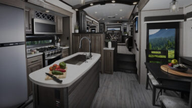The kitchen and living area of a Jayco front living fifth wheel