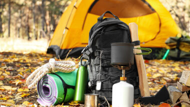A campers belongings filled with items from a fall camping packing list