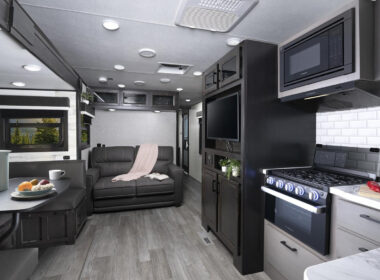The kitchen and dining area inside a Jayco Jay Feather