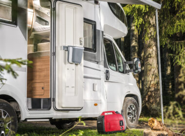 A woman sitting by her RV and her RV generator 50 amp