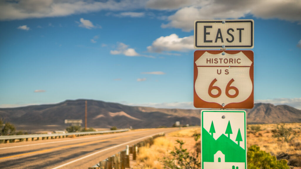 A route 66 sign on the highway, which is apart of the musical highway