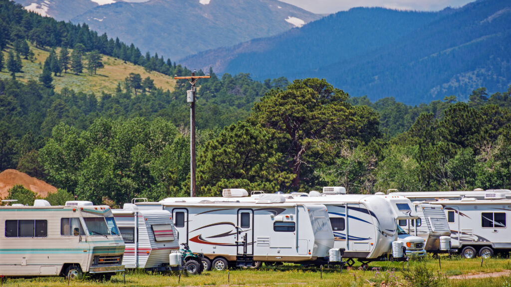 RVs parked in a RV lot by the mountains