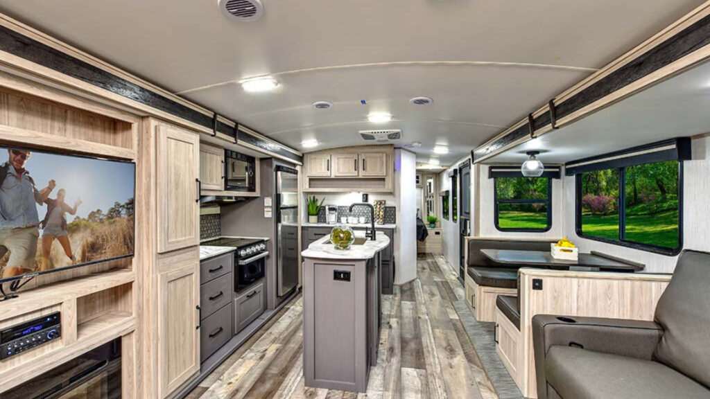 The kitchen and living area inside one of the best cold weather travel trailers, a Heartland Sundance Ultra-Lite 262RB