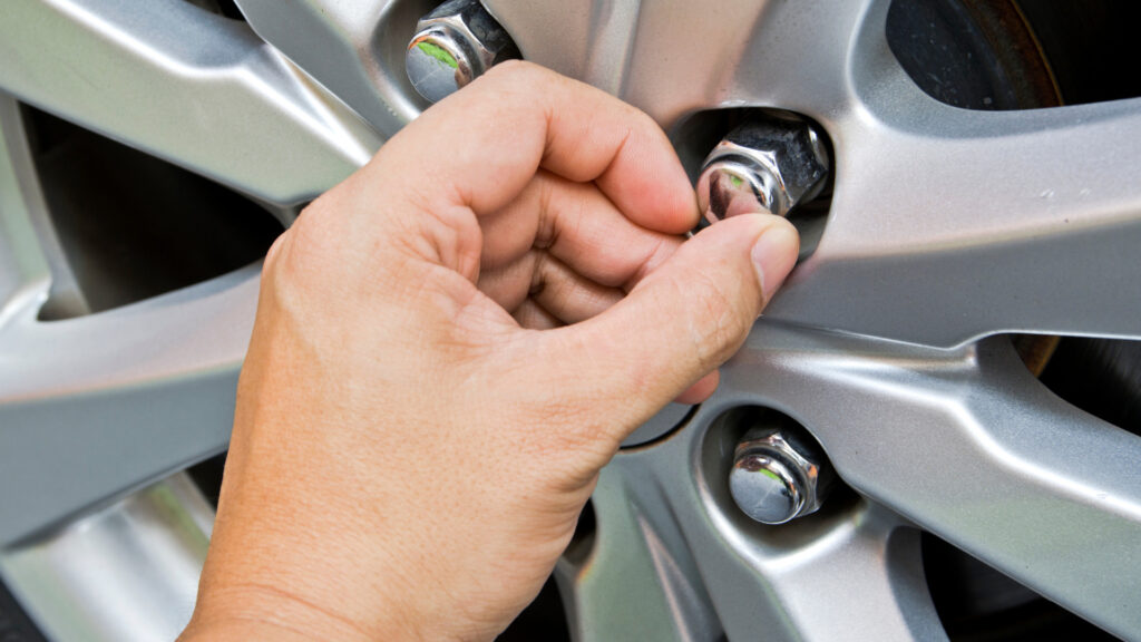 A person charing their RV lug nut after finding the right size
