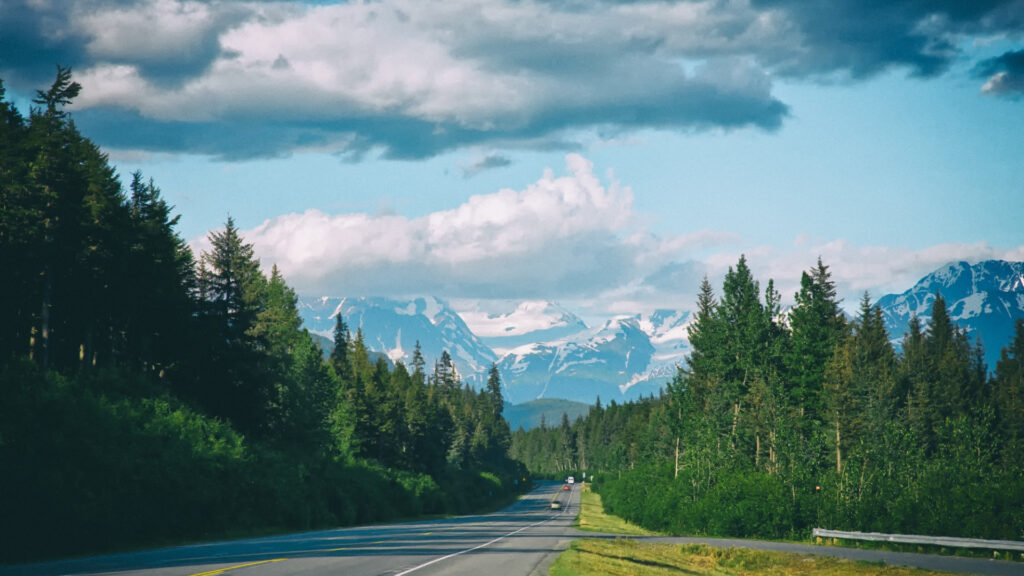 A car driving down Alaska, which you can not drive from to Russia due to how far is it is
