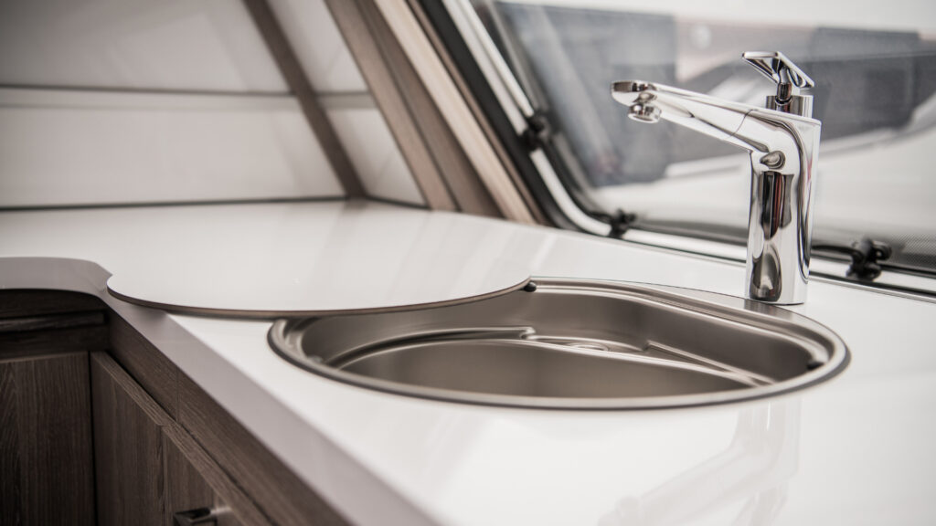 A sink in an RV that isn't working yet, requiring troubleshooting for a water heater