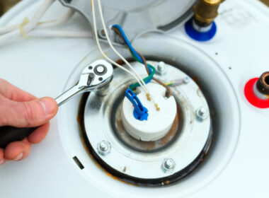 A person troubleshooting their RV water heater