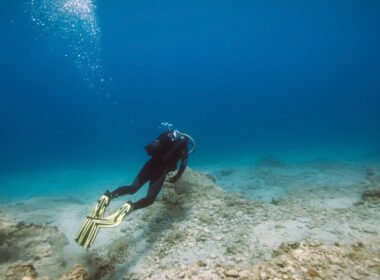 A person scuba diving in blue lagoon texas