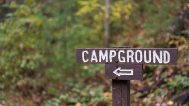 A Thousand Trails campground sign where you can stay at with a membership available for sale