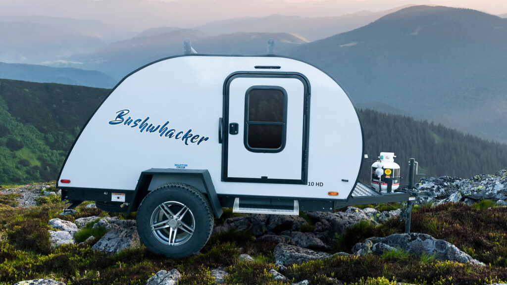A Bushwhacker camper parked outside
