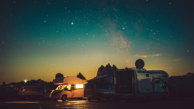Multiple RVs at their campground in the dark after arriving late at night