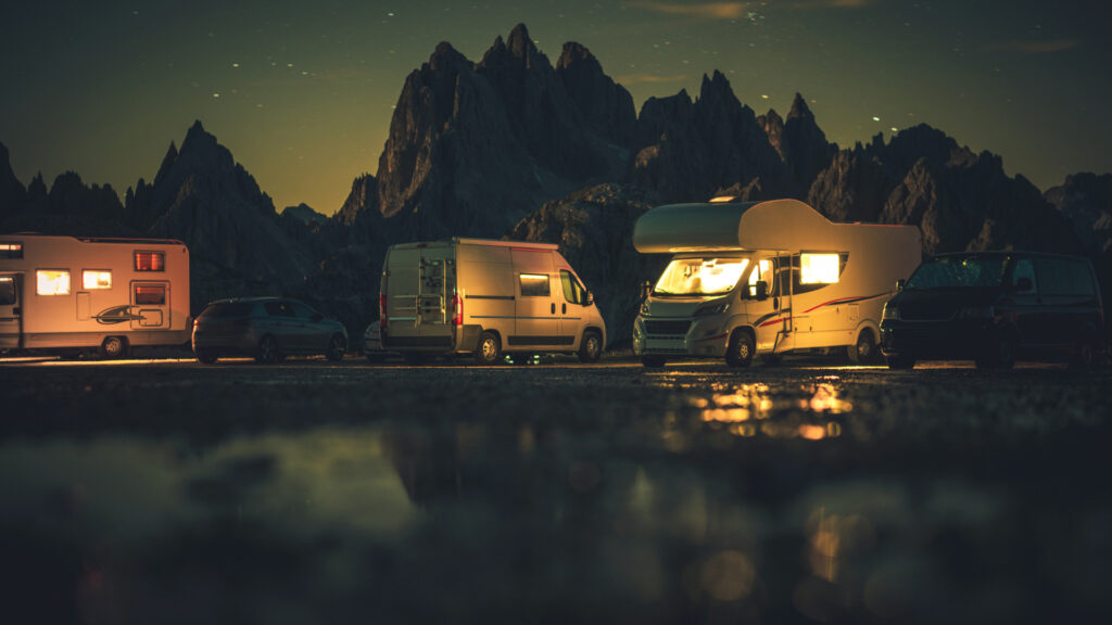 Multiple RVs at their campground in the dark after arriving late at night