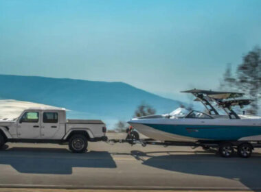 A jeep gladiator towing a boat and testing the towing capacity