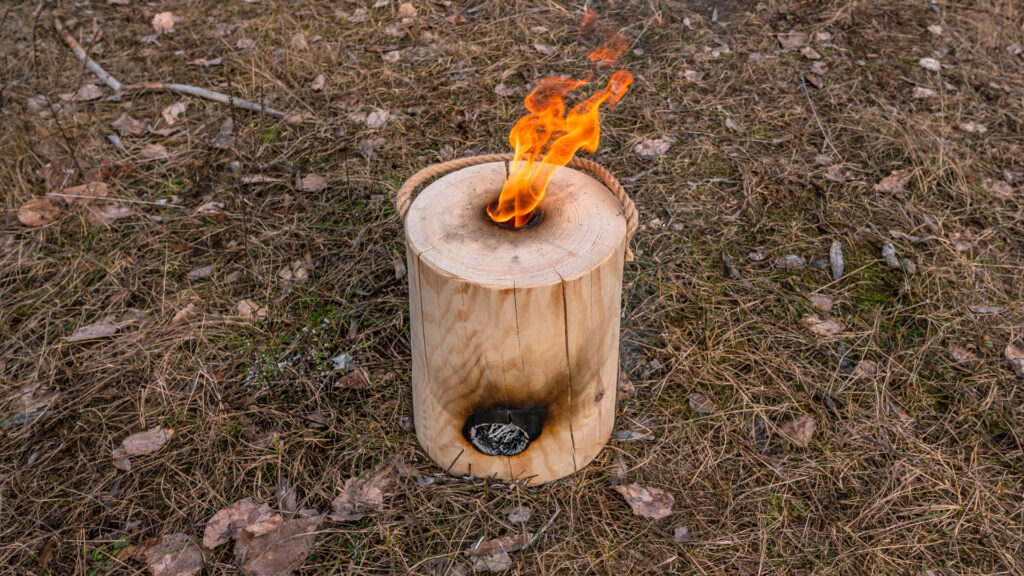 A lit swedish fire log