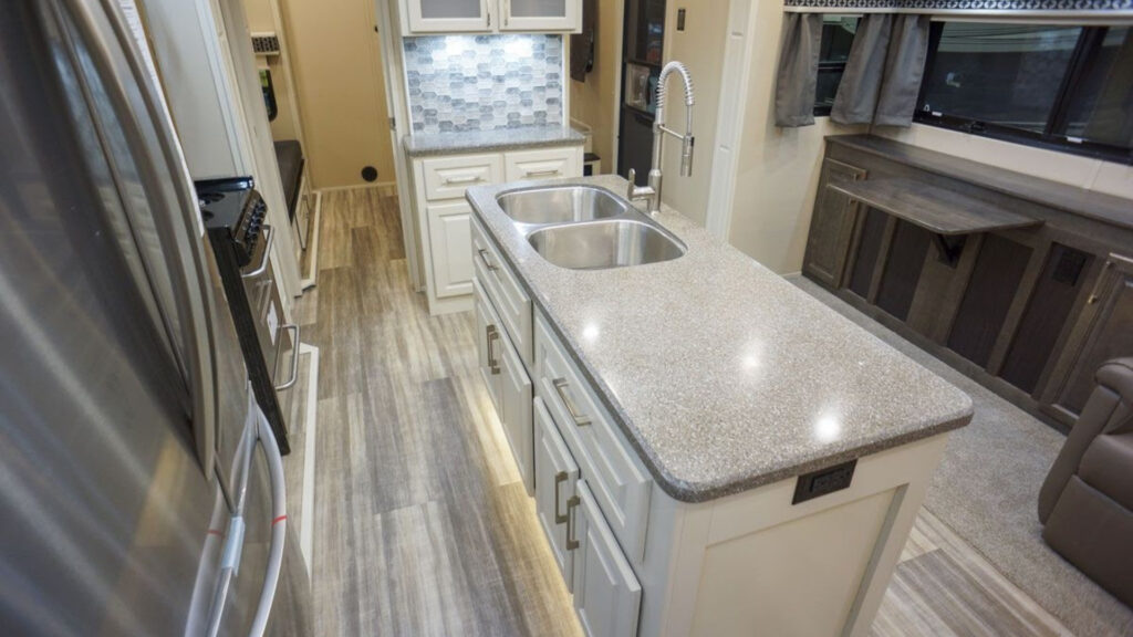 The kitchen area inside a Luxe Golf fifth wheel