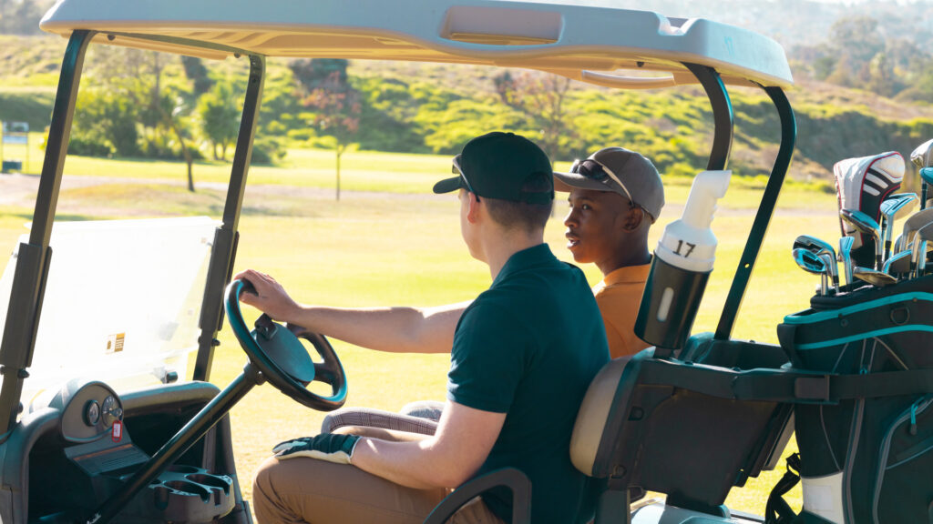 Two young boys driving a golf cart with a valid license