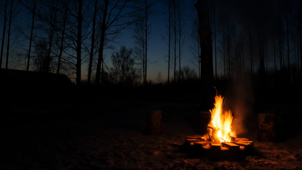 A campfire at night that was started by following five rules for the perfect campfire