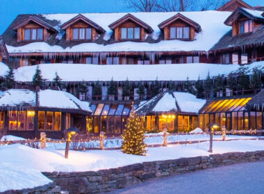 The von trapp family lodge in the winter covered in snow