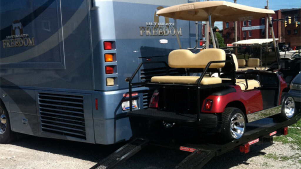 A Mighty Hauler Golf Cart carrier attached to an RV