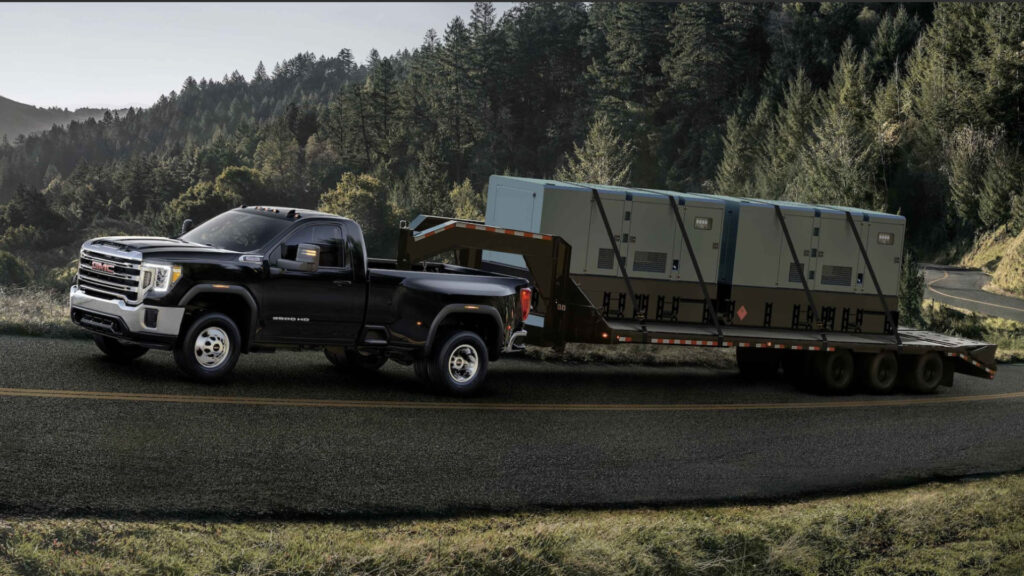 A gmc sierra 3500 with a great towing capacity on the road towing a trailer