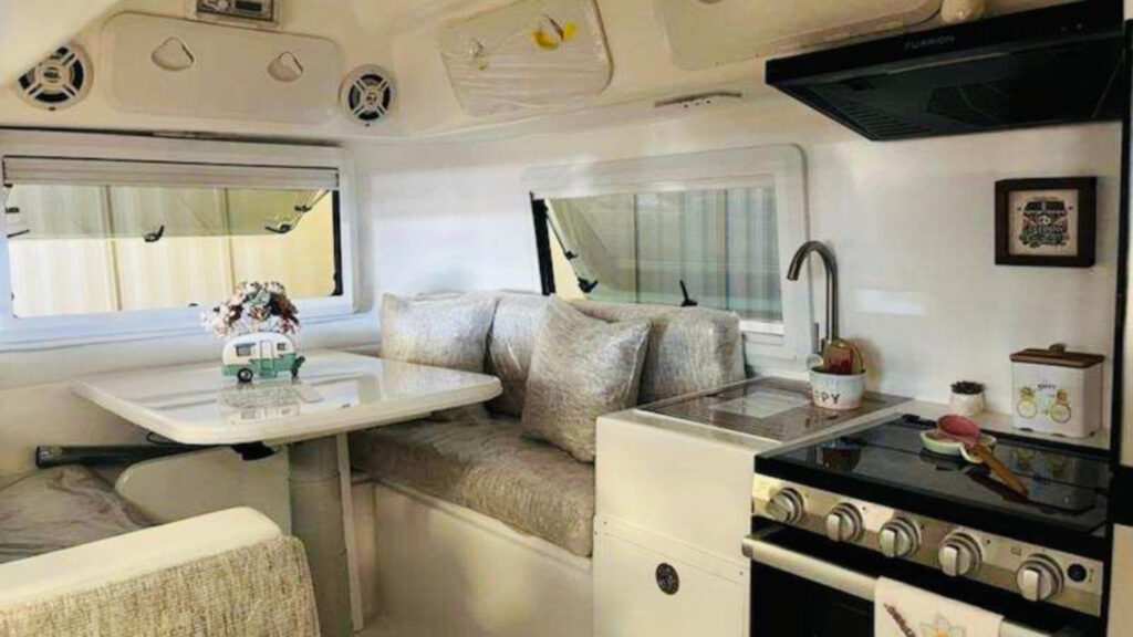 The kitchen and living area inside a Cortes Camper