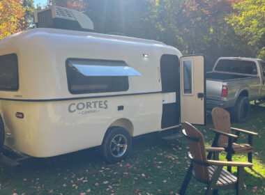 A Cortes Camper being towed by a truck