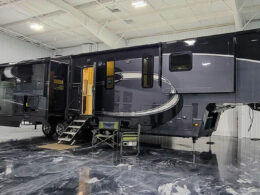 A luxe 5th wheel parked inside