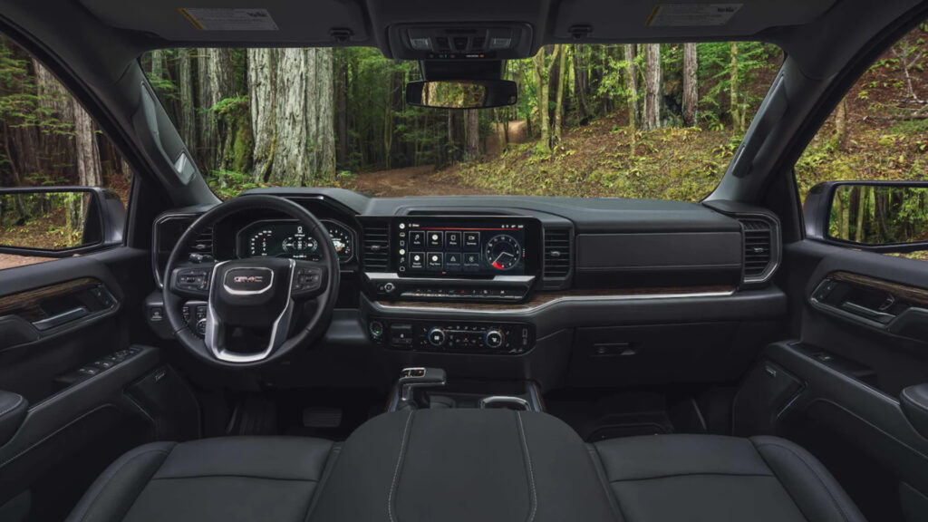 Inside a gmc sierra 1500  parked in the woods with an impressive towing capacity