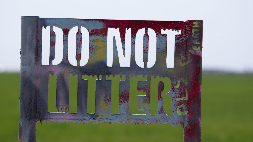 A do not litter sign at: Cadillac Ranch