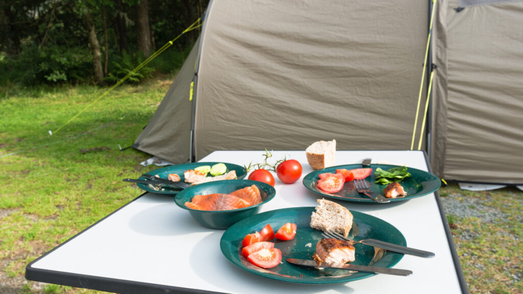 Food on a table in front of a tent