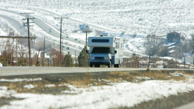 An RV on the road during winter