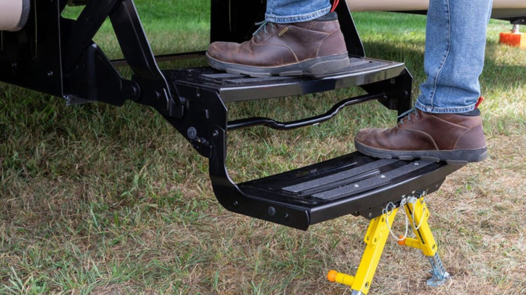 A person using their Lippert rv step stabilizers