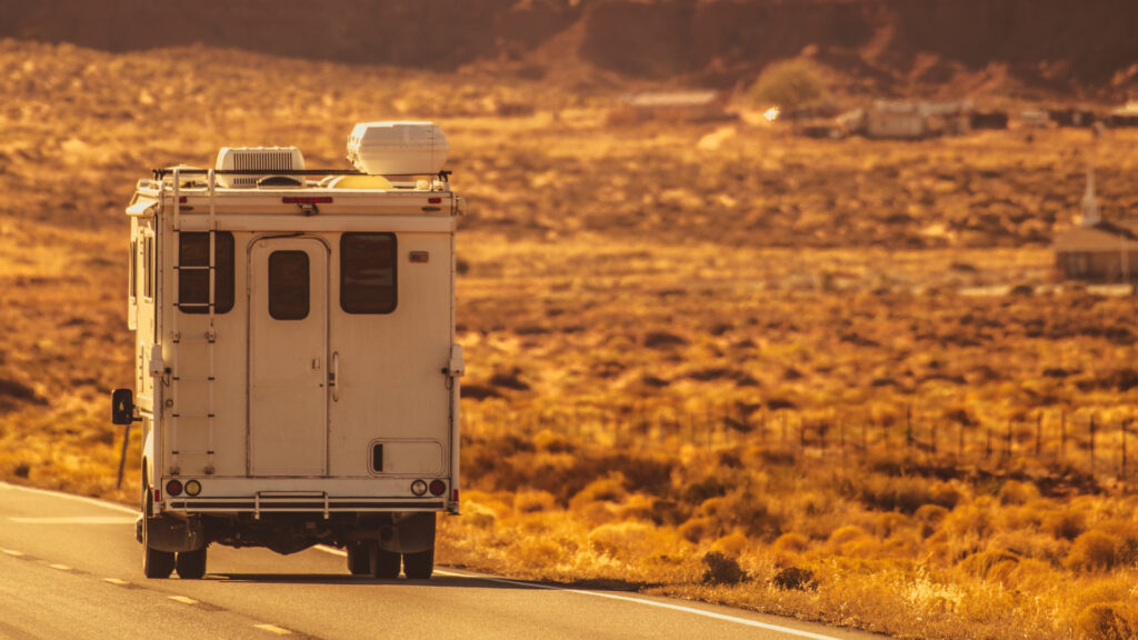 A truck camper on the road