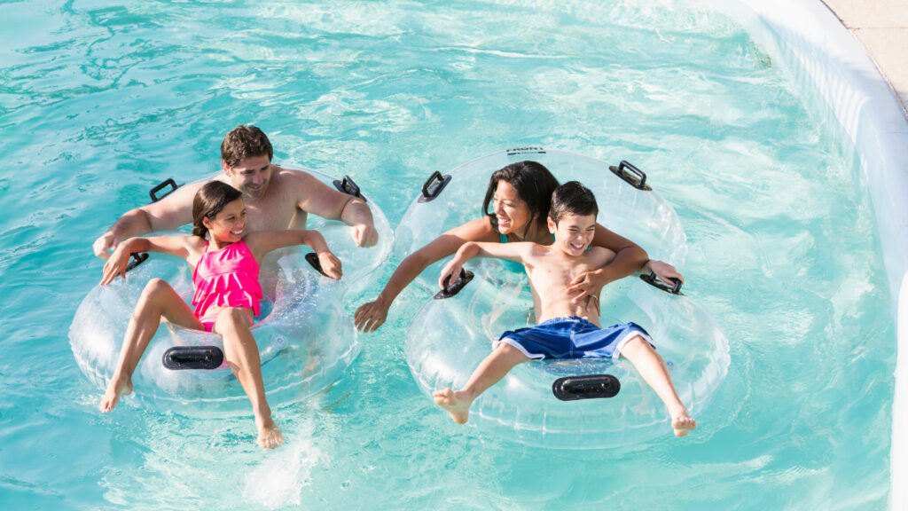 A family in a lazy river at an indoor water park in Texas