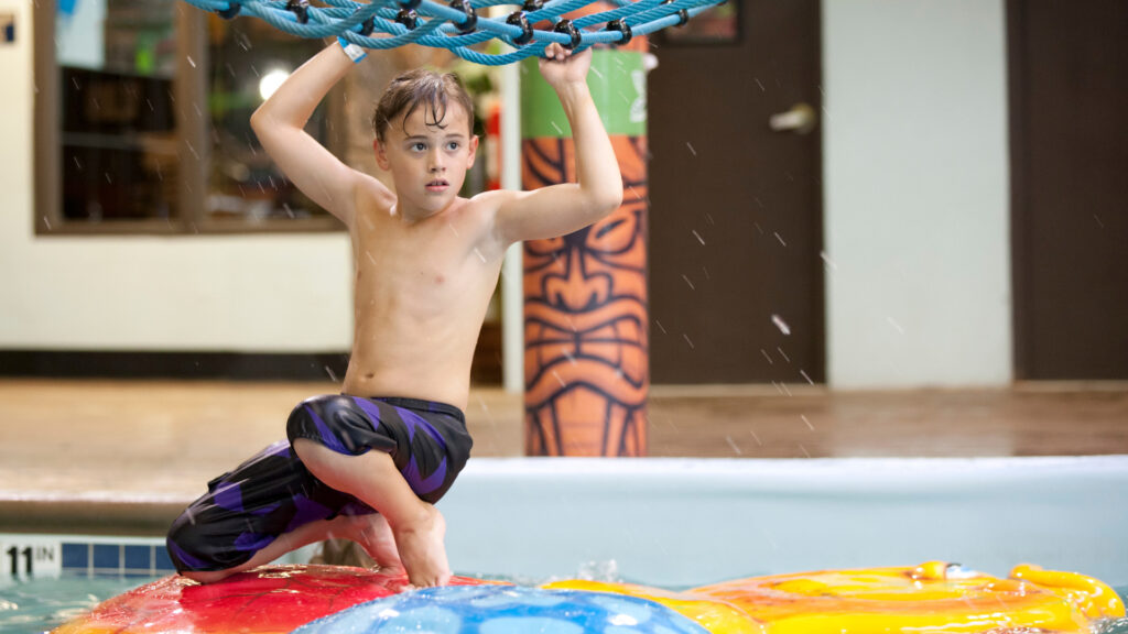 A kid playing at an indoor water park in Texas
